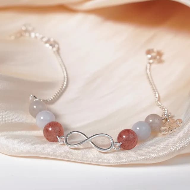 Lắc bạc Diên charm vô cực phối thạch anh dâu tây, moonstone trên nền lụa kem